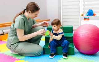 Occupational therapy tools including sensory balls, therapy putty, and balance boards designed to support children’s development at home.