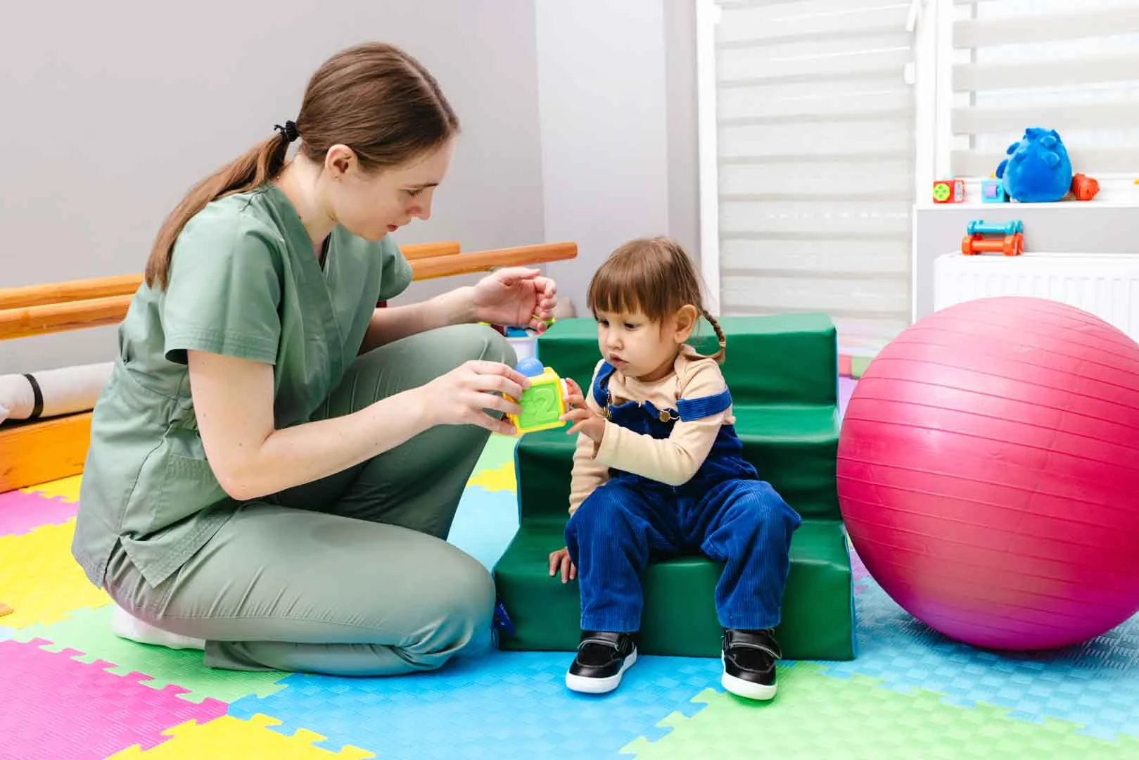 Child improving motor skills through occupational therapy at OrbRom Center Phnom Penh