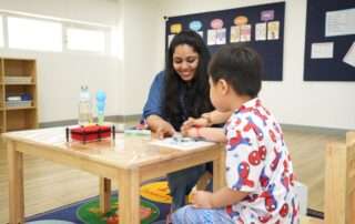 Child receiving developmental support services in a therapeutic learning environment at OrbRom Center in Phnom Penh.