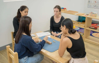 Educators and therapists collaborating at OrbRom Center in Phnom Penh to enhance special education services for children with diverse needs.