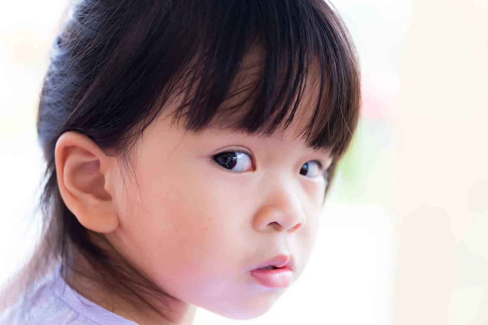 Young girl looking anxious and silent, possibly experiencing selective mutism, needing speech therapy support in Phnom Penh