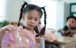 Asian child receiving therapy support in a sensory-friendly setting