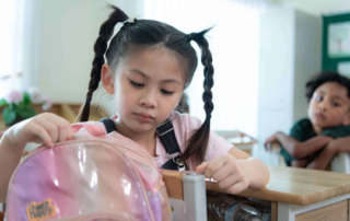 Asian child receiving therapy support in a sensory-friendly setting