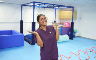 Occupational therapist smiling in a sensory gym room at OrbRom Center Phnom Penh