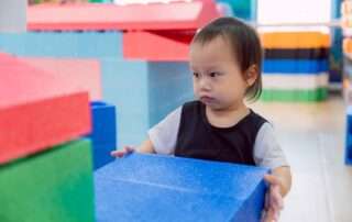 Child psychologist at OrbRom Center evaluating developmental milestones of a young student in Phnom Penh.