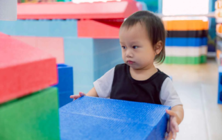 Child psychologist at OrbRom Center evaluating developmental milestones of a young student in Phnom Penh.