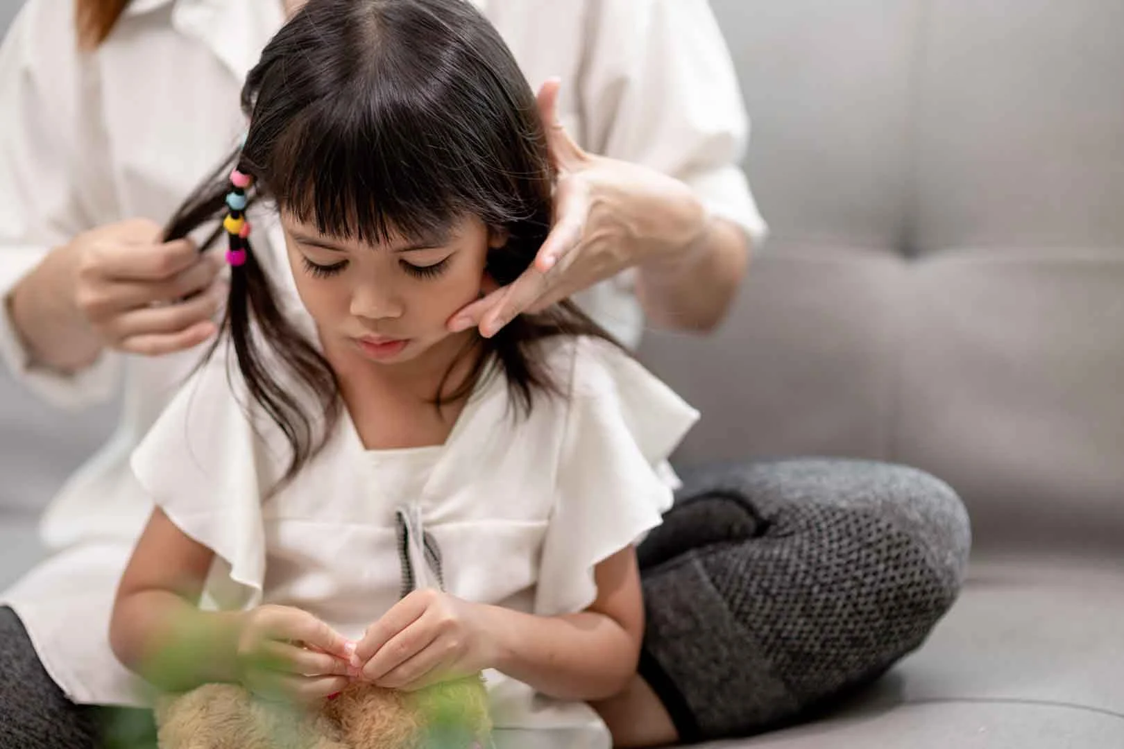 Speech therapist at OrbRom Center working with a young child during an early intervention session in Phnom Penh