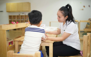 Therapist working one-on-one with a young child during an early intervention session at OrbRom Center in Phnom Penh