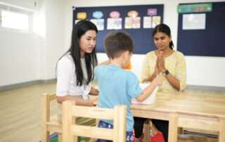 Teacher assistant supporting a speech therapy session at OrbRom Center in Phnom Penh