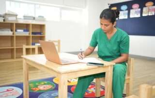 Rasika, Speech and Language Therapist at OrbRom Center in Phnom Penh, preparing therapy plans for children and families