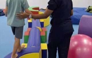Child receiving professional therapy support at OrbRom Center in Cambodia