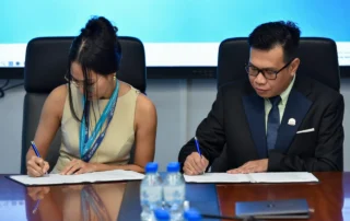 Sophaneth Heng, CEO OrbRom Center and Singapore Cambodia International Academy (SCIA) representatives signing a Memorandum of Understanding to strengthen inclusive education and student support services.