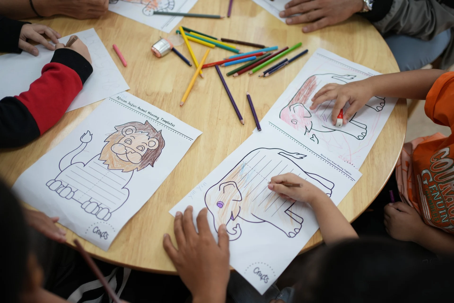 Children working on coloring and drawing tasks to improve fine motor and attention skills