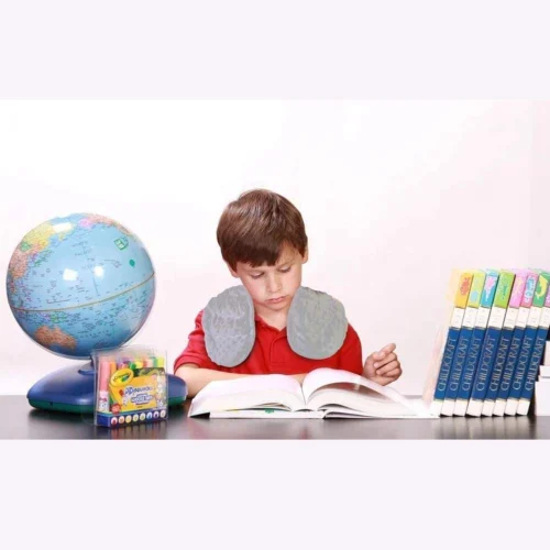 Child wearing a weighted shoulder wrap for sensory calming and focus support